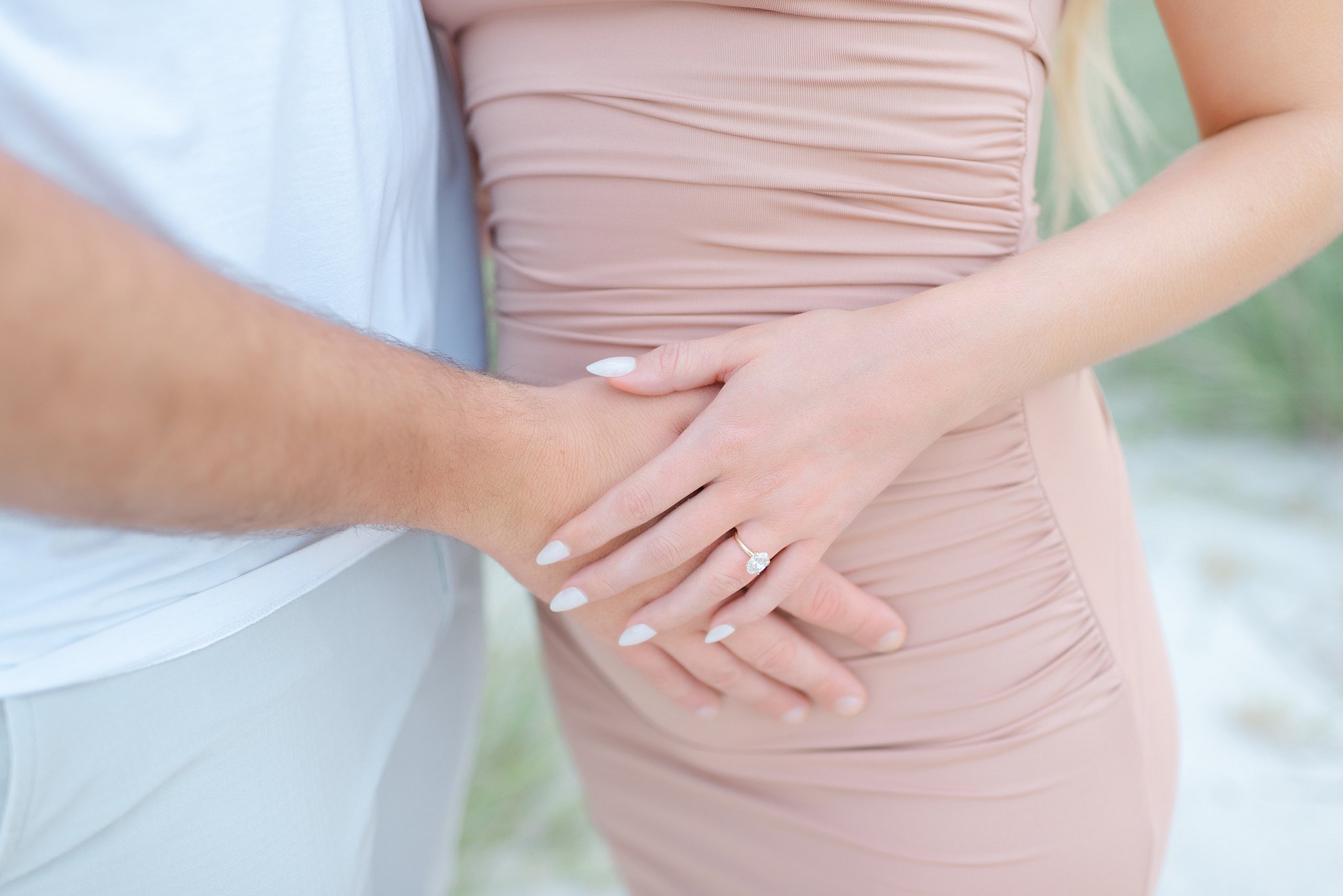 Details of expecting parents with hands on the bump after visiting a prenatal chiropractor jacksonville fl