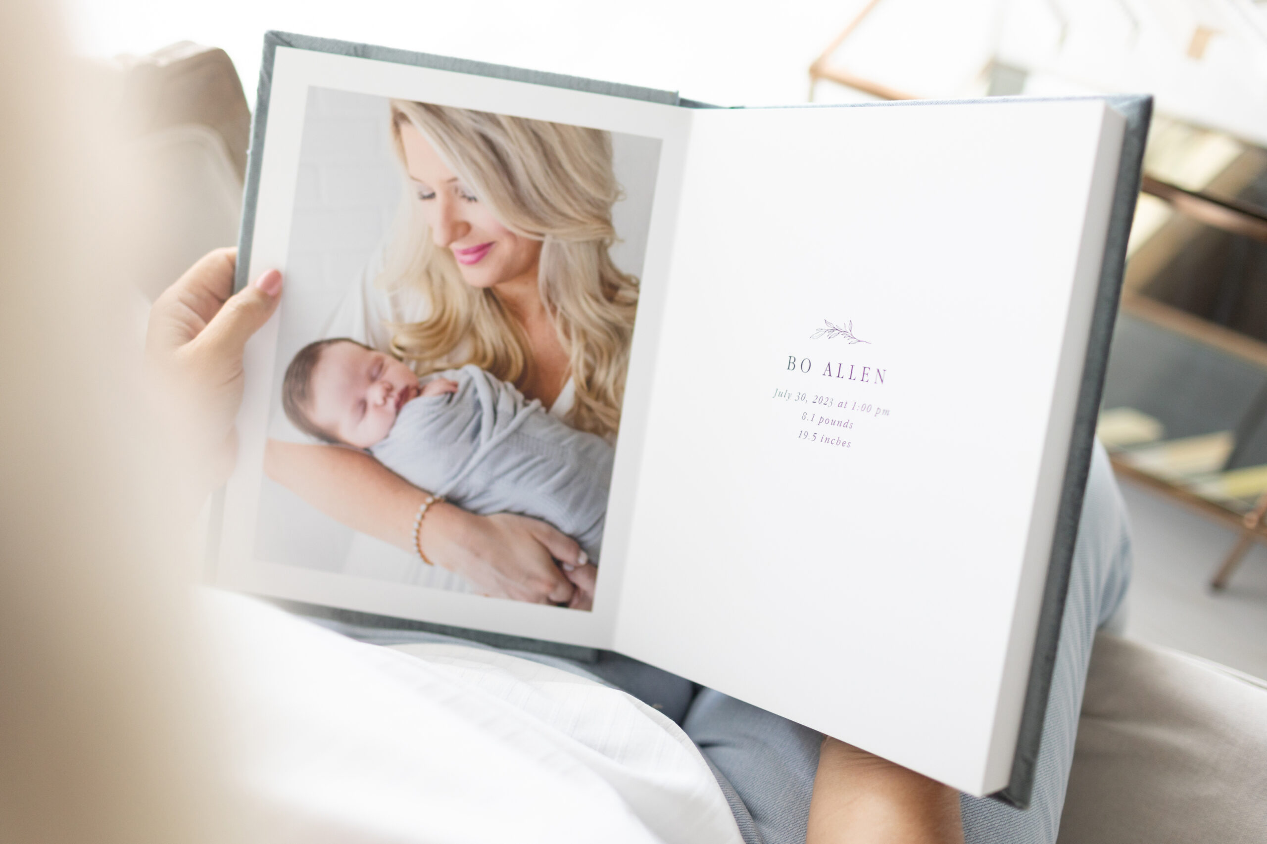 An heirloom album with images of a newborn session