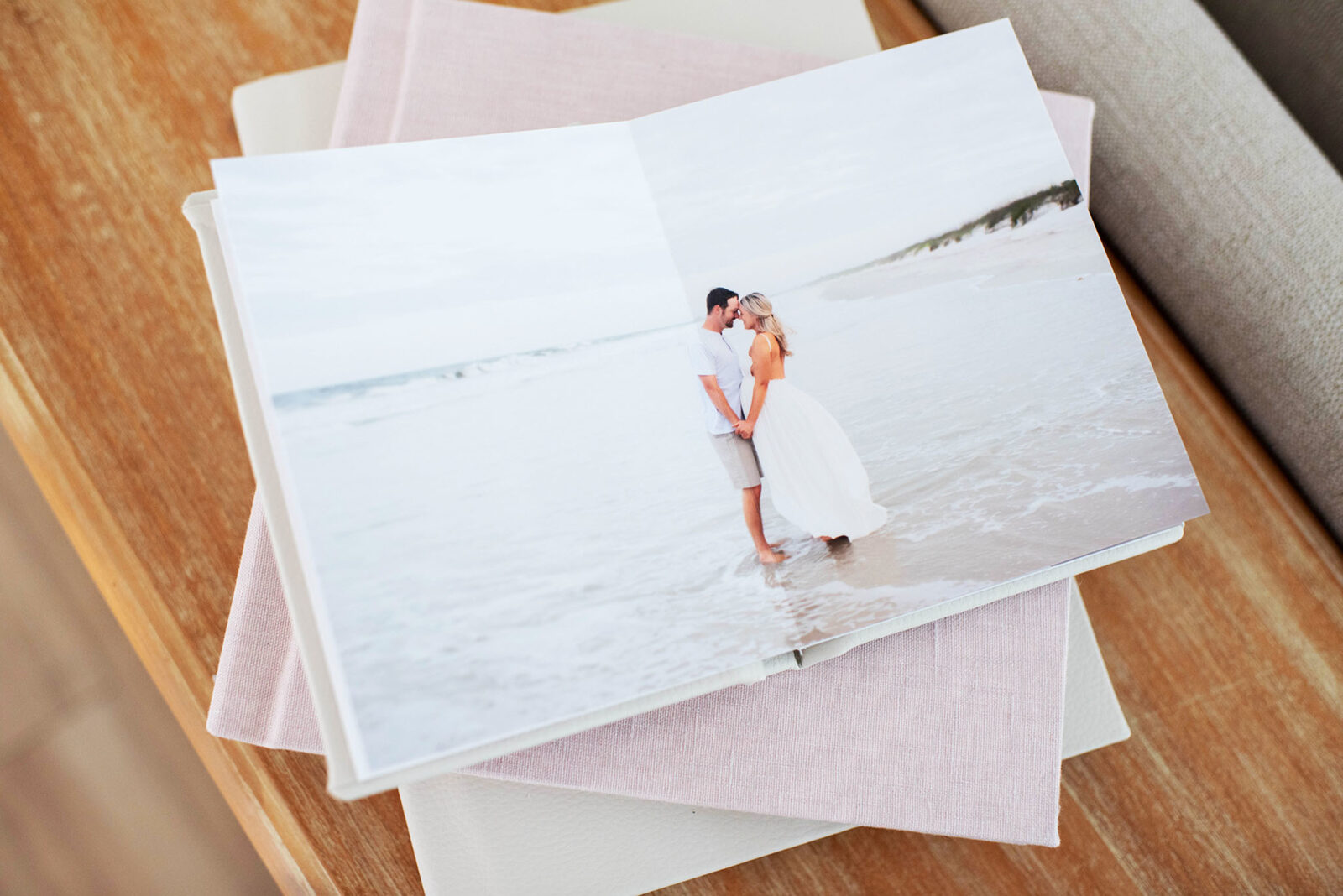 An heirloom album filled with photos from a maternity session