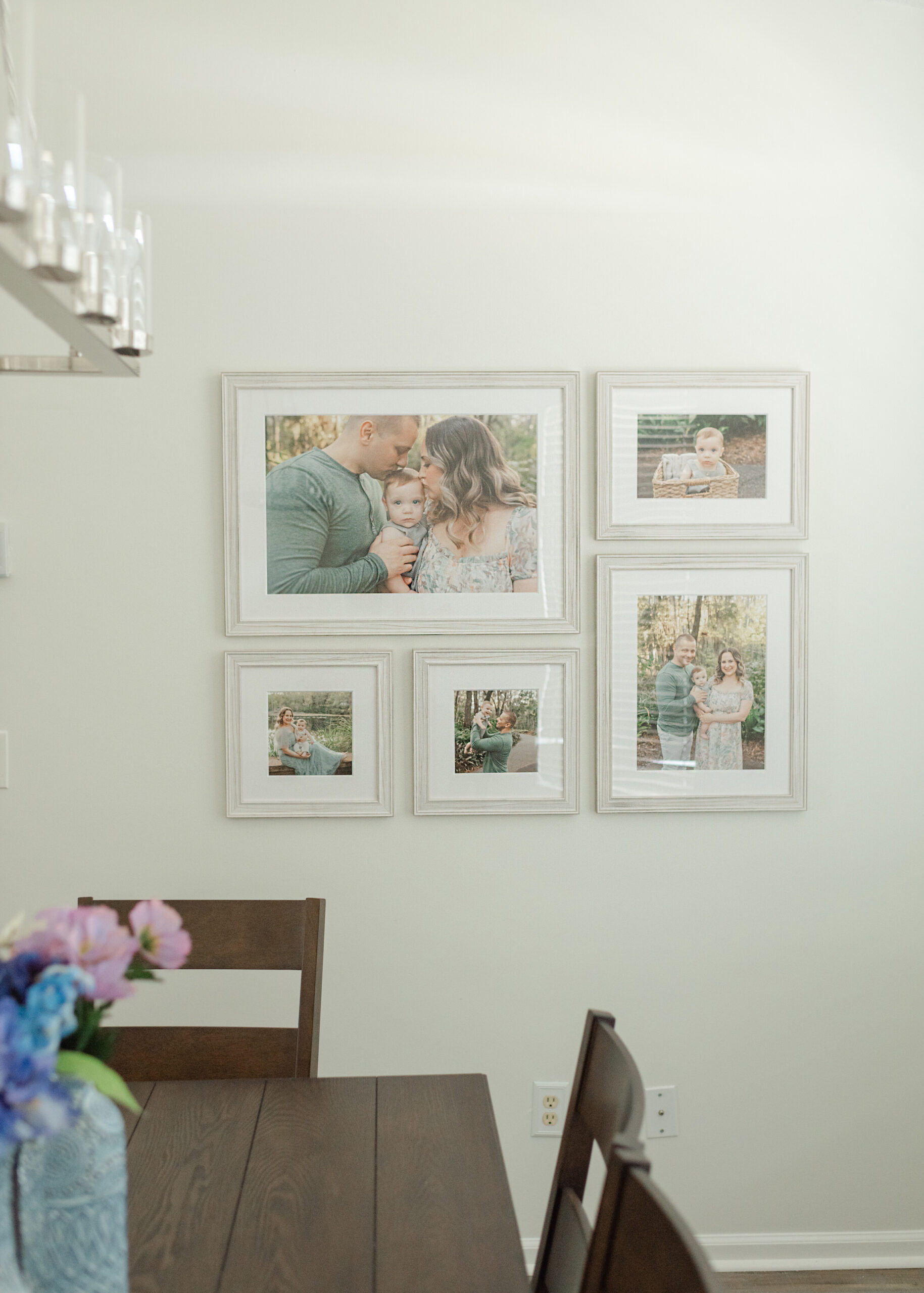 Custom artwork installation of a family session framed wall gallery