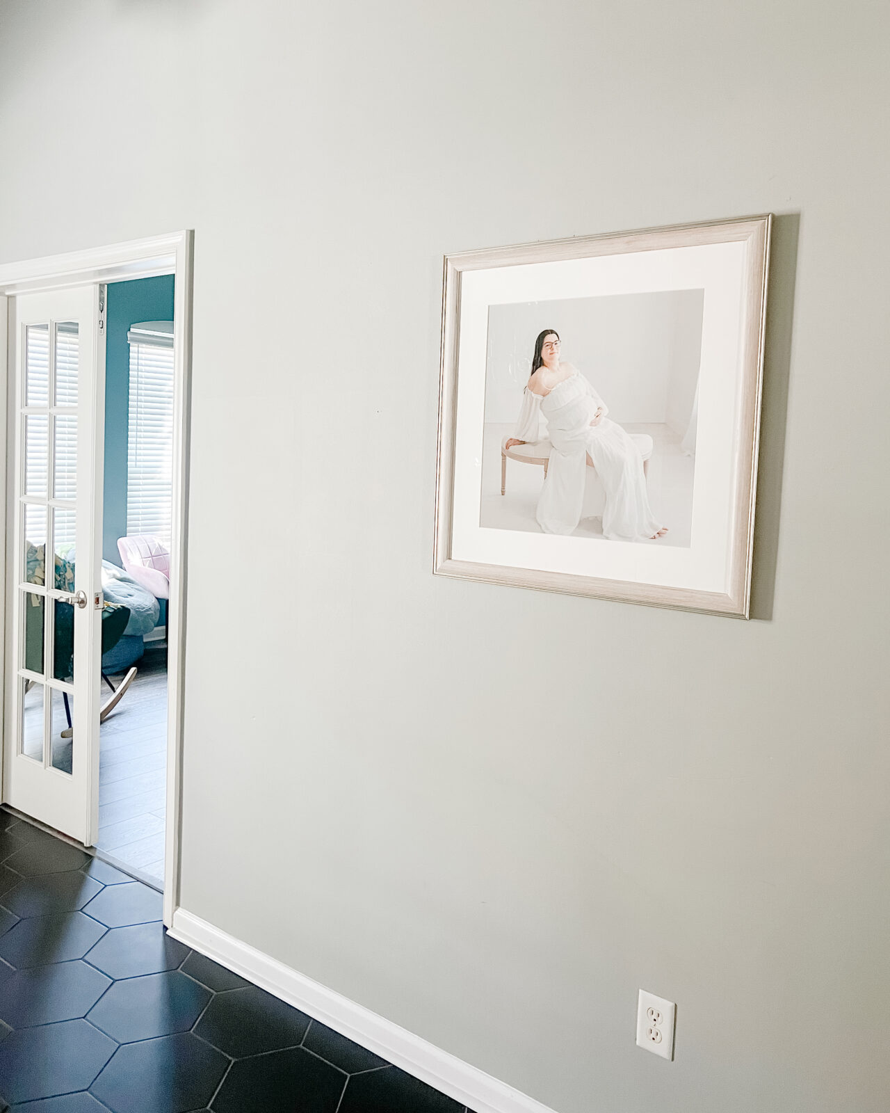 Installation of custom artwork of a maternity statement frame
