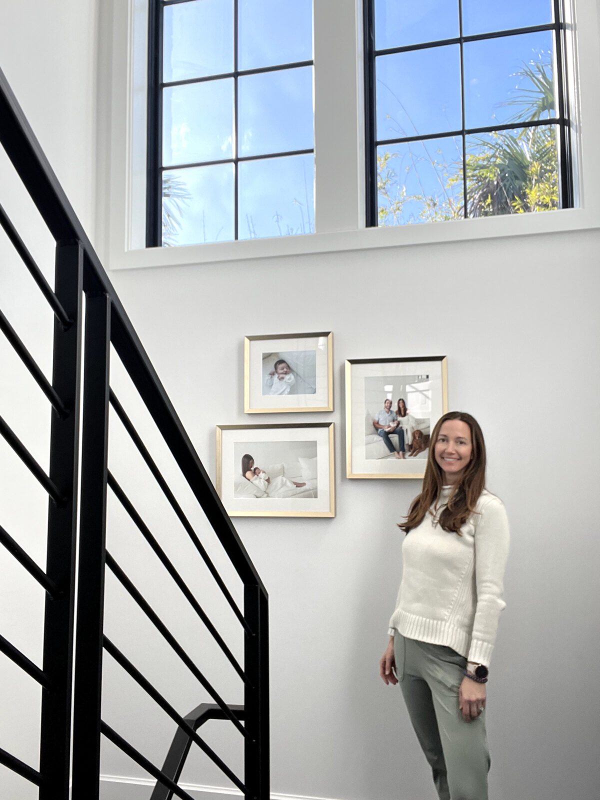 Installation of a newborn session framed wall gallery
