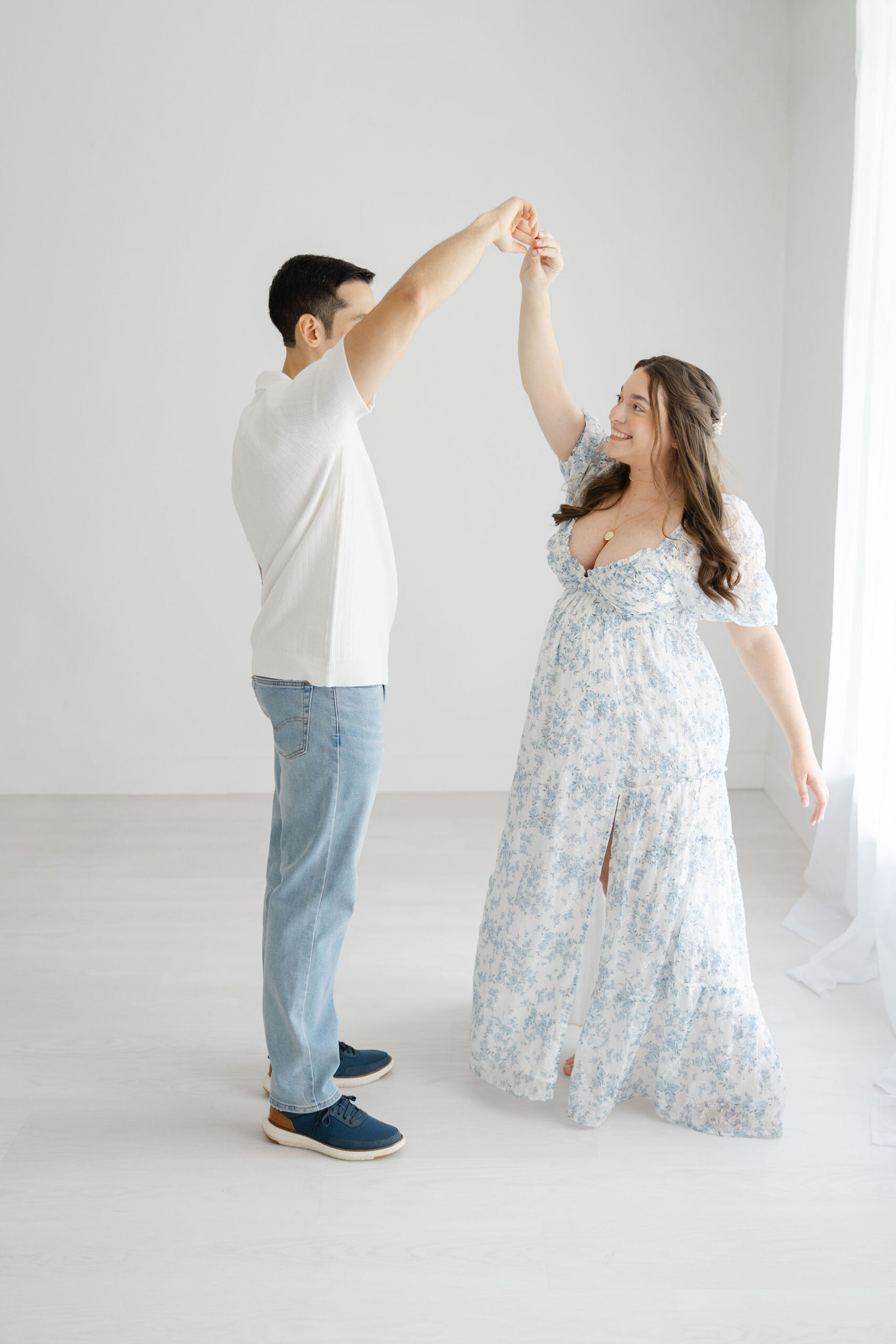 lowing gown worn during studio maternity photography session