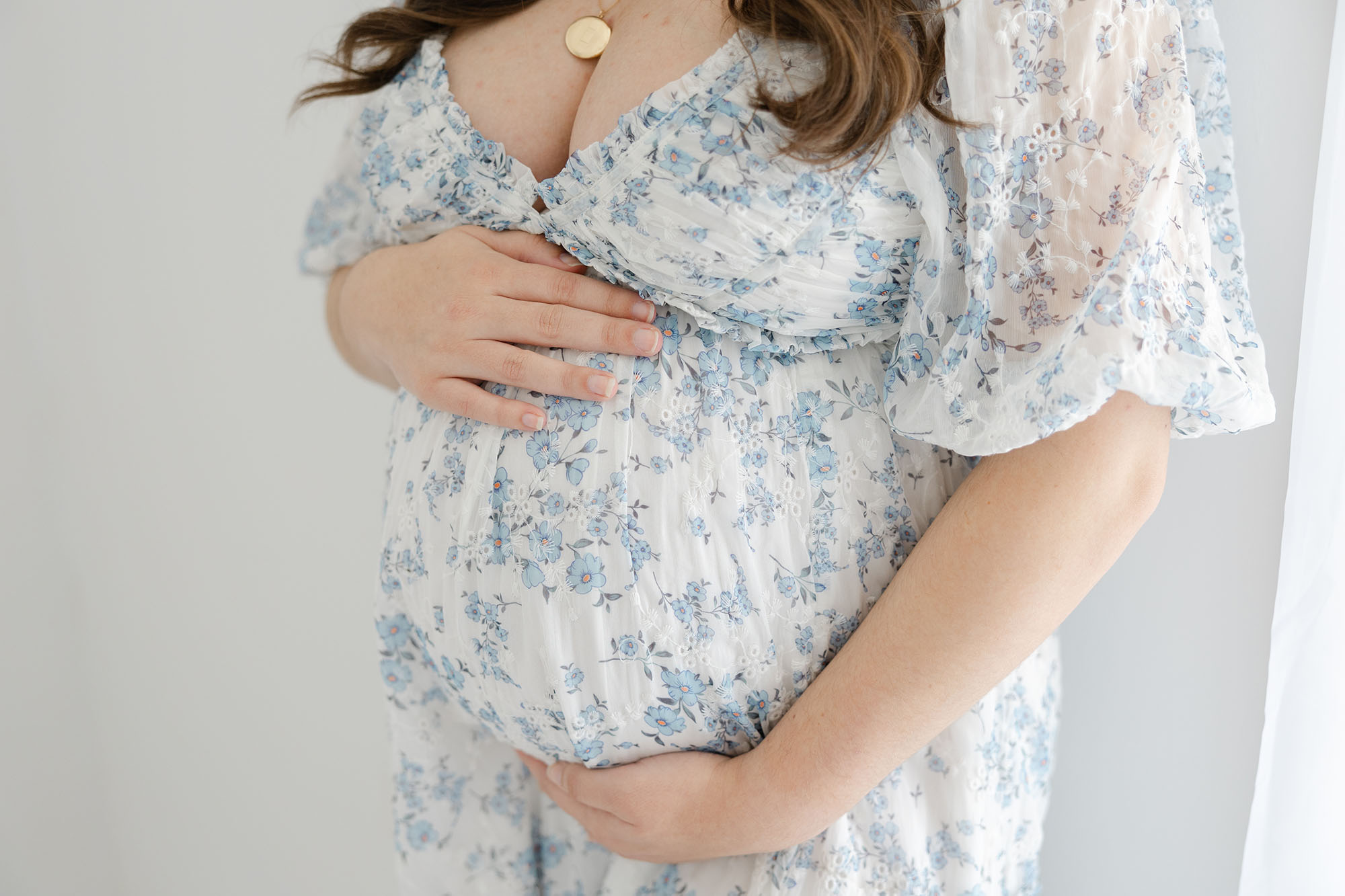close up of pregnant belly in studio setting