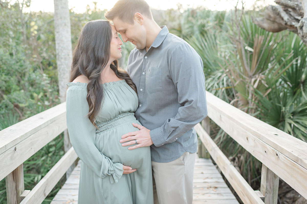 Expecting couple during elegant maternity photo session
