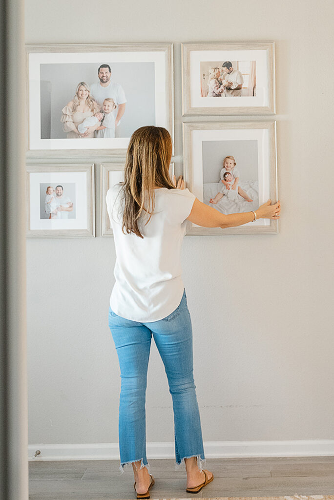 family photos hung on wall in clients home