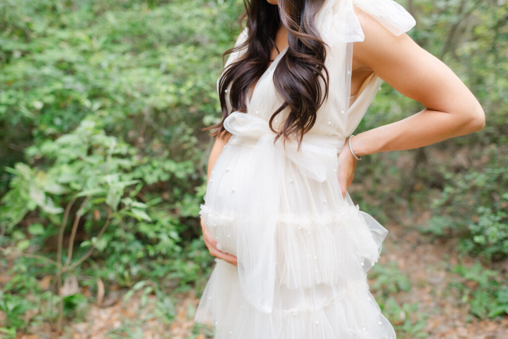 Maternity photography session in Jacksonville Florida featuring woman holding belly
